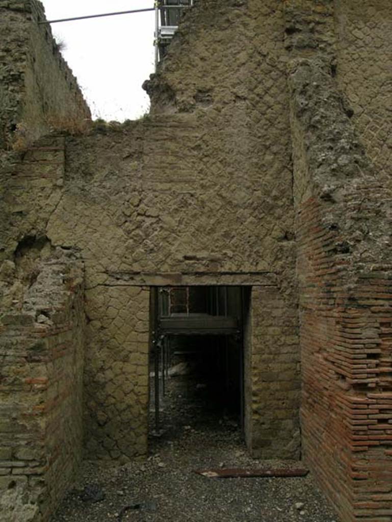 Ins. Or. II.7, Herculaneum. June 2006.
Looking west towards doorway in west wall of a room, reached by Ins.Or.II.7, but which may be part of the rooms of the Palaestra at Ins.Or.II.4 (room C).
Photo courtesy of Nicolas Monteix.